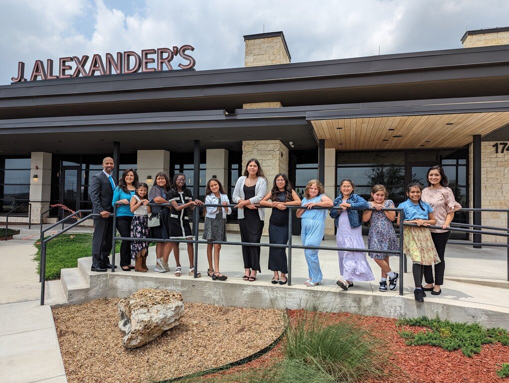 Group shot of YLO students in front J. Alexander's